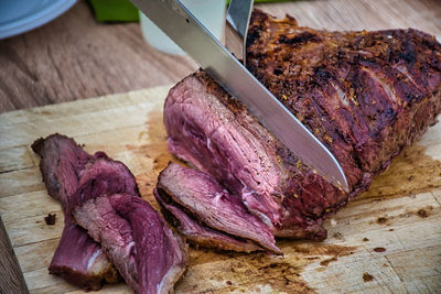 High angle view of meat on cutting board