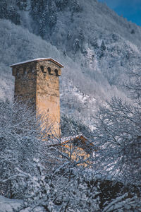 Stone wall of building during winter