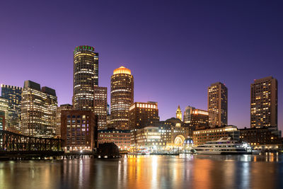 Illuminated buildings in city at night