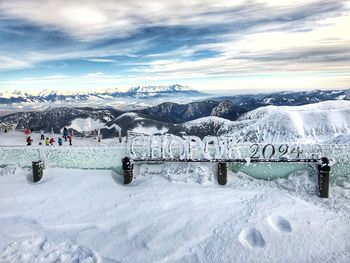 Scenic view of snow covered landscape against sky