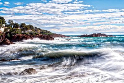 Scenic view of sea against cloudy sky