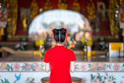 Rear view of a statue against temple