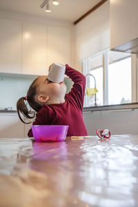Girl sitting at table