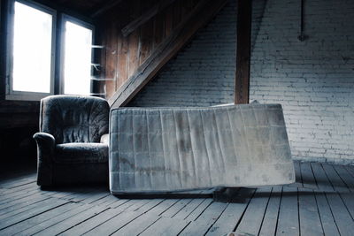 Empty chair in abandoned room