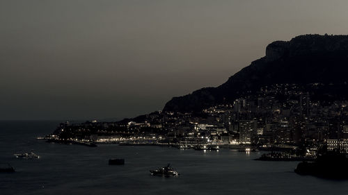 Scenic view of sea against sky at dusk