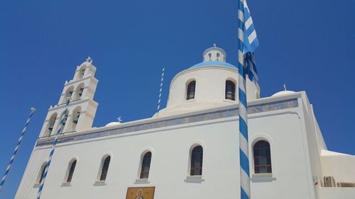 Low angle view of building against blue sky