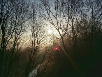 Scenic view of river at sunset