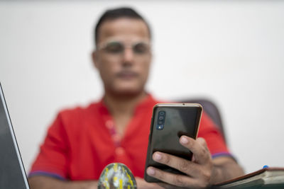 Portrait of man using mobile phone