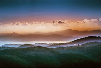 Scenic view of mountains against sky during sunset