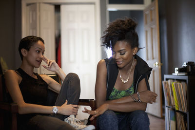 Young couple sitting in front of woman