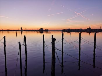 Scenic view of lake against sky during sunset