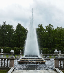Fountain in park against sky