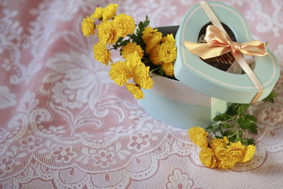 High angle view of yellow roses on table