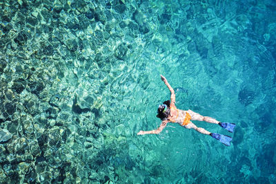 High angle view of man swimming in sea