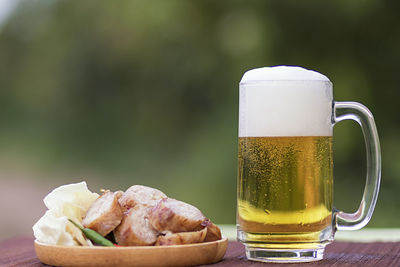 Close-up of beer in glass on table