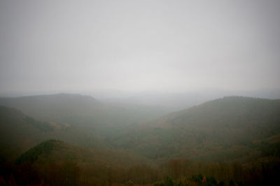 Scenic view of mountains during foggy weather