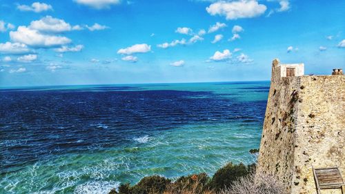 Scenic view of sea against blue sky