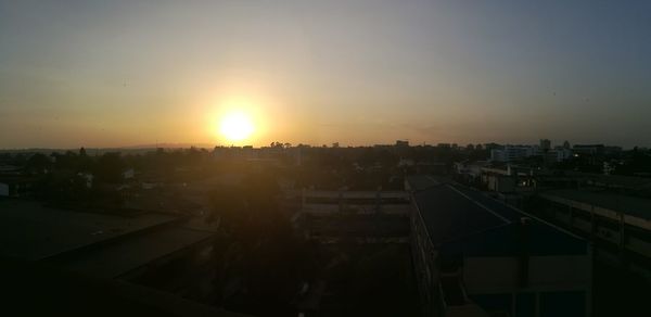 View of cityscape against sky during sunset