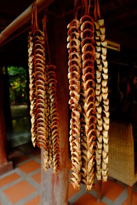 Close-up of bucnch of dry areca nut, bitter nut hanging on display at home