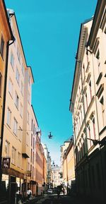 Low angle view of buildings against blue sky