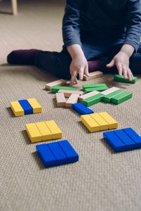High angle view of boy playing with toy on table