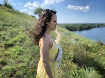 Side view of young woman looking away