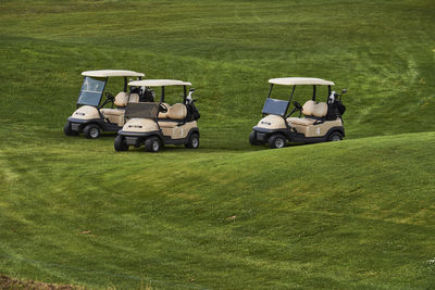 High angle view of people playing golf course