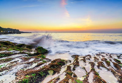 Scenic view of sea against sky during sunset