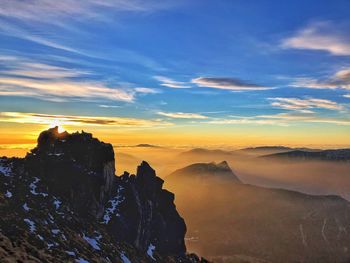 Scenic view of mountains against sky during sunset