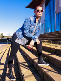 Low section of woman standing on steps