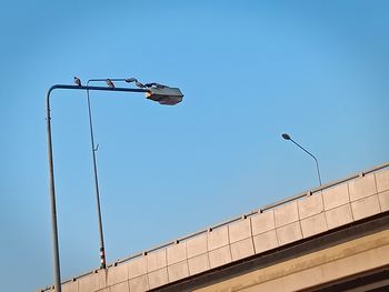 Low angle view of street light against clear sky