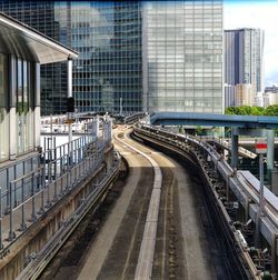 High angle view of railroad tracks amidst buildings in city