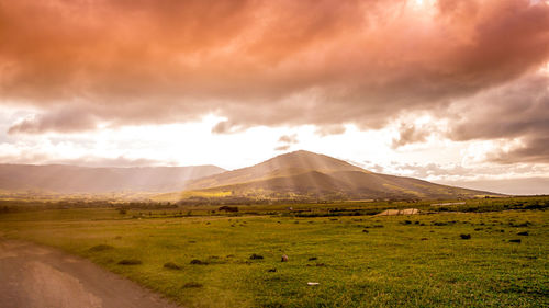 Scenic view of landscape and mountains against sky