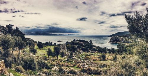 Scenic view of sea against cloudy sky