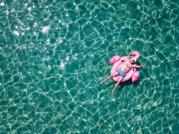 High angle view of girl swimming in pool