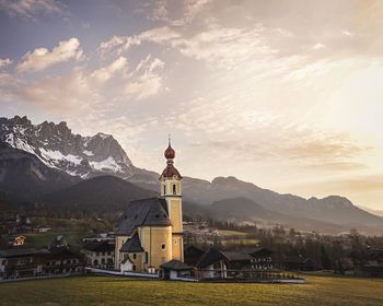 Church amidst buildings against sky