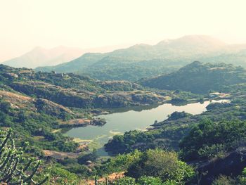 Scenic view of landscape and mountains against sky