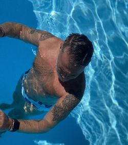 Man swimming in pool