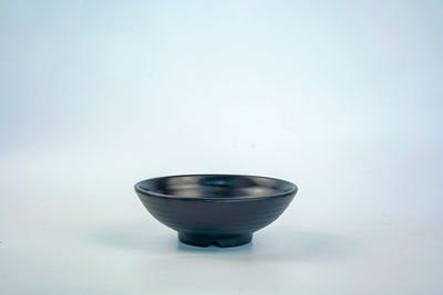 Close-up of glass of water against white background