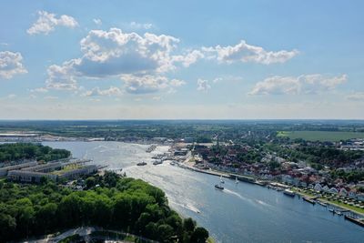 High angle view of river by city against sky