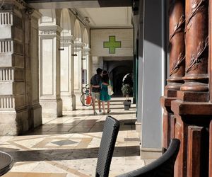 Rear view of couple walking on corridor