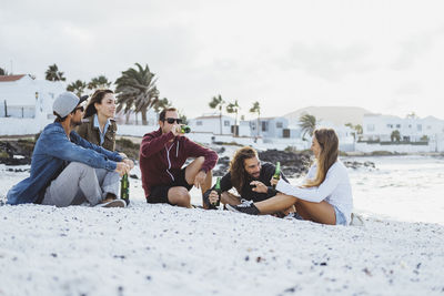 Young couple sitting on beach