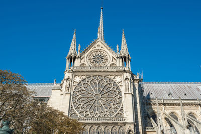 Low angle view of a building against blue sky