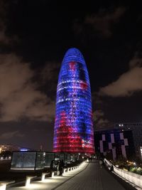 Low angle view of illuminated city at night