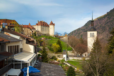 Buildings in city against sky