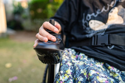 Midsection of woman holding hands