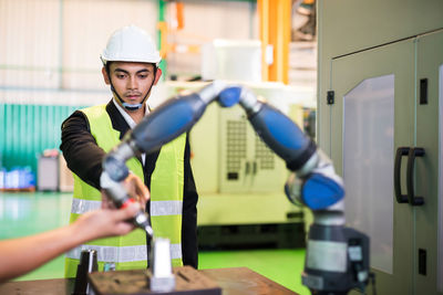 Side view of man working in gym