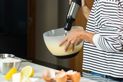 Midsection of woman holding food