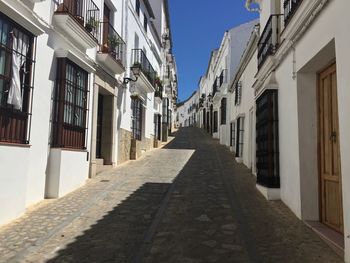 Narrow alley amidst buildings in town