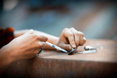 Midsection of man working on table